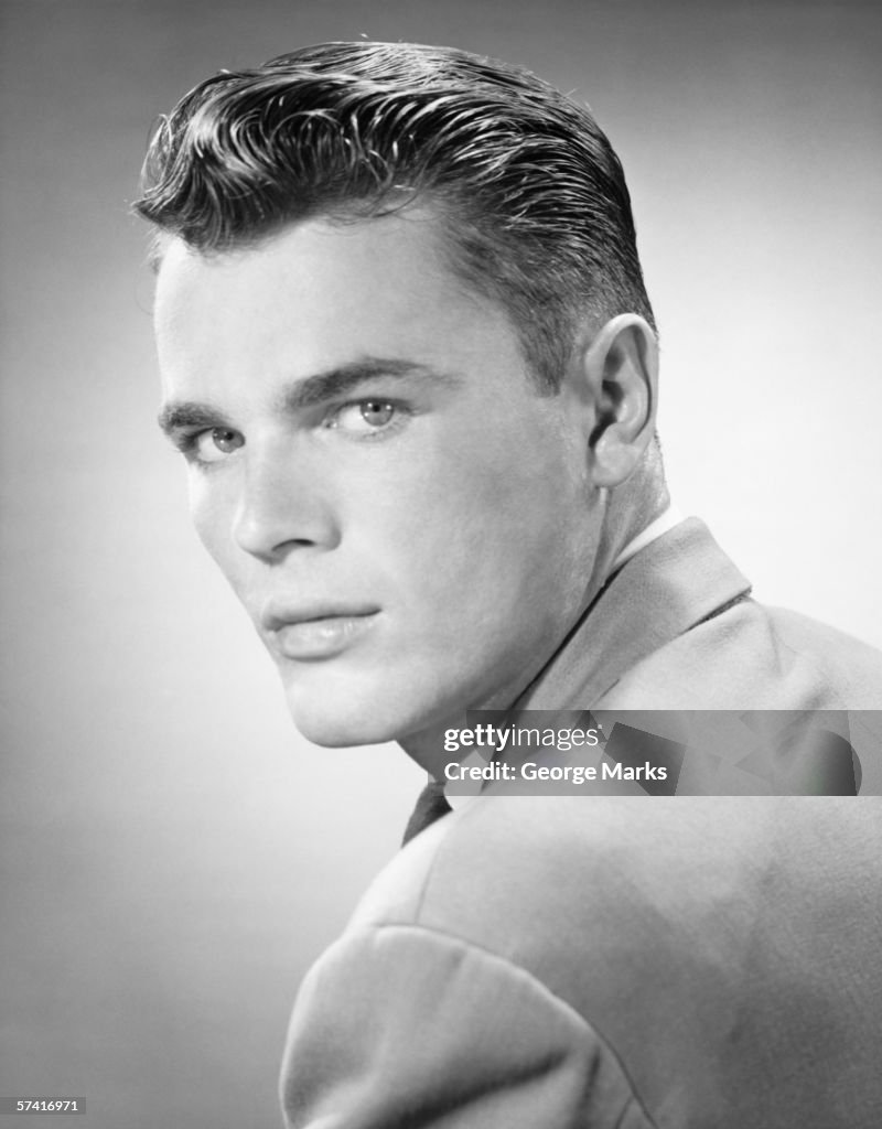 Young man posing in studio, (B&W), (Close-up), (Portrait)