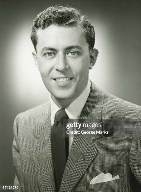 young man in checked jacket posing in studio, (b&w), (close-up), (portrait) - 1950 stock pictures, royalty-free photos & images