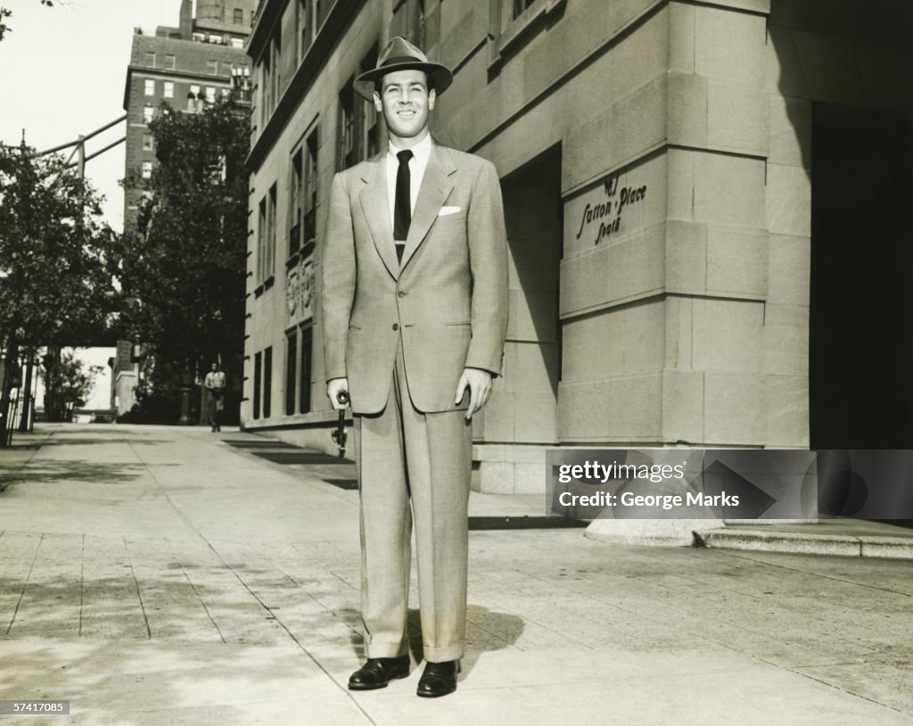 Man in full posing on Manhattan street, New York City, (B&W), (Portrait)