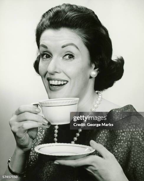 elegant holding cup and saucer, (b&w), (portrait) - cup saucer stock pictures, royalty-free photos & images