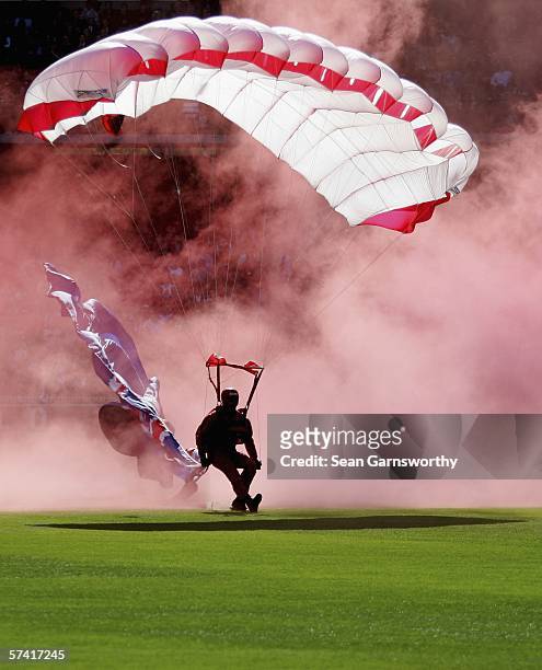 The Army Red Beret Parachute Team arrive at the MCG prior to the round four AFL match between the Collingwood Magpies and the Essendon Bombers at the...