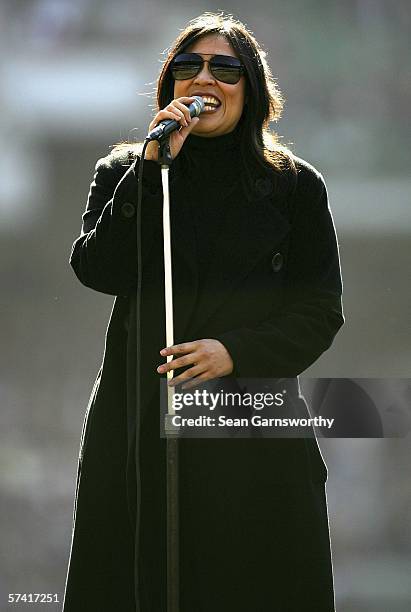 Australian artist Kate Ceberano sings prior to the round four AFL match between the Collingwood Magpies and the Essendon Bombers at the Melbourne...