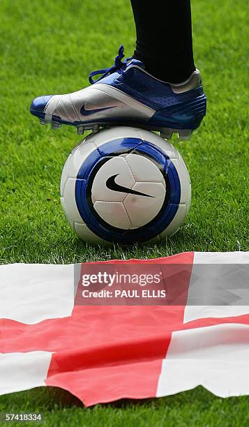 Manchester, UNITED KINGDOM: England and Manchester United soccer player Wayne Rooney displays the boots that he will wear during this summer's World...