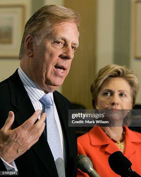 Senator Hillary Clinton listens to Liz Claiborne Chairman Paul R. Charron speak during a news conference on Capitol Hill April 25, 2006 in Washington...