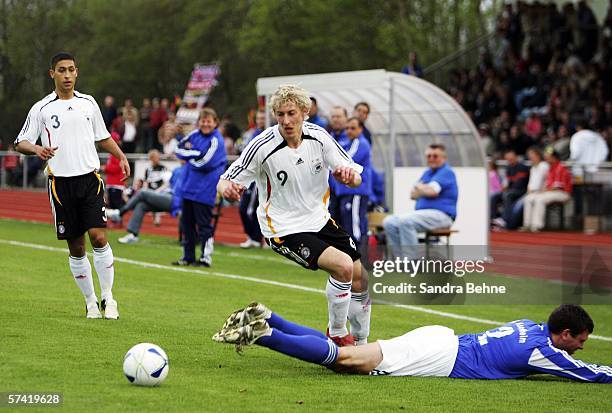 Stefan Kiessling of Germany challenges Stephen Wright of Aschheim during the friendly match between FC Aschheim and the Under 21 German National Team...