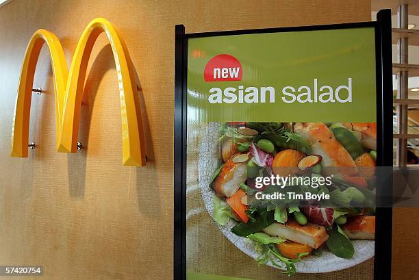 Display for McDonald's Asian Salad, part a their new "Go Active Happy Meal," is visible next to a McDonald's logo April 25, 2006 in a McDonald's...