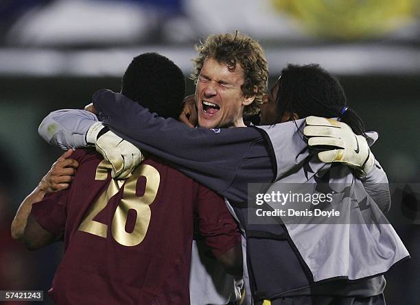 Jens Lehmann of Arsenal celebrates with Kolo Toure at the end of the UEFA Champions League semi-final, second leg match between Arsenal and...