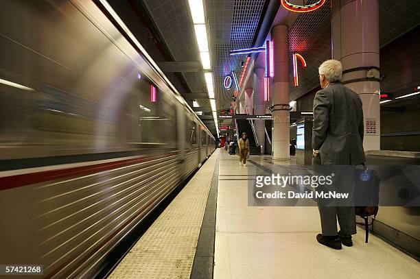 Rider waits to board as a train arrives at the subway stop at Pershing Square on April 25, 2006 in Los Angeles, California. As gasoline prices soar,...