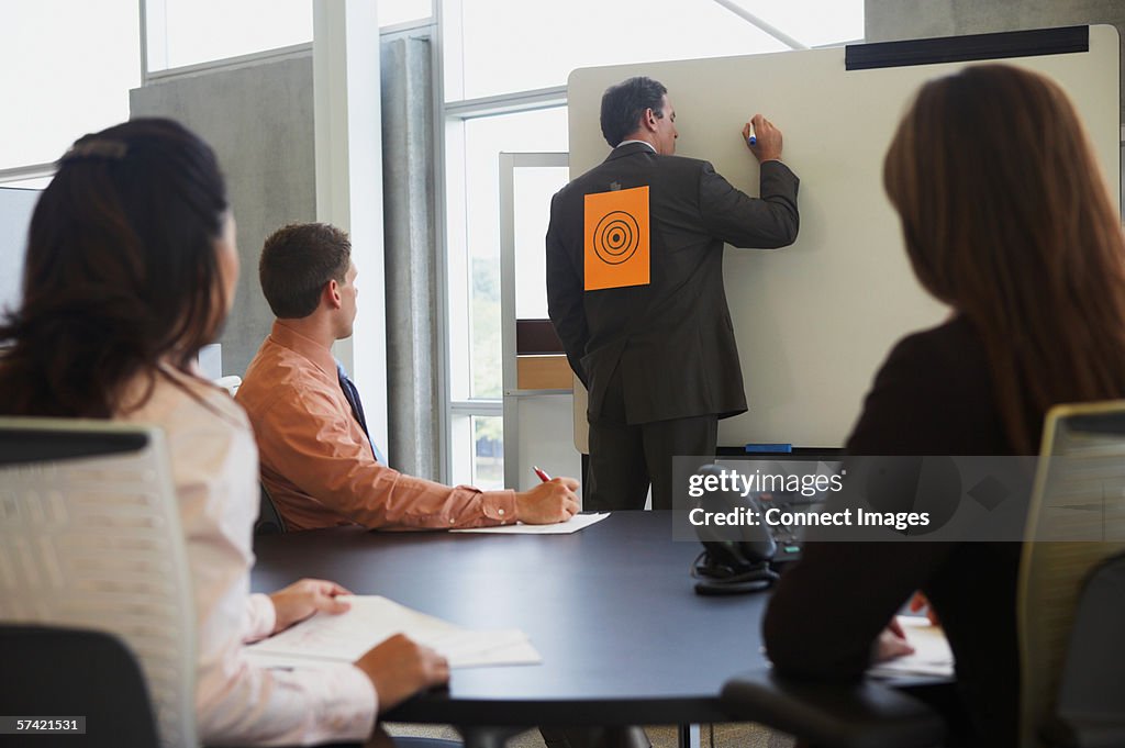 Businessman with sign on his back
