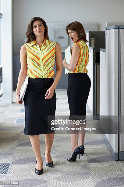 two businesswomen wearing matching outfits - matching outfits stock pictures, royalty-free photos & images