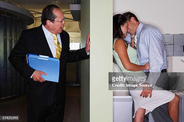 boss catches colleagues kissing - couple trapped stock pictures, royalty-free photos & images