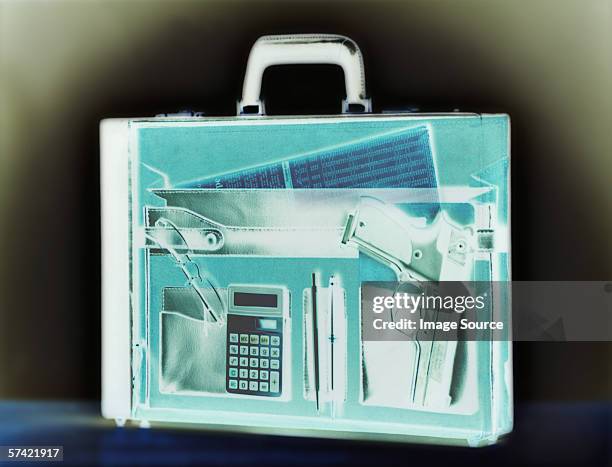 gun in a briefcase - airport x ray images stock pictures, royalty-free photos & images