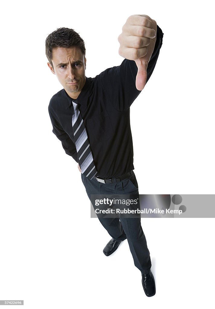 High angle view of a businessman showing thumbs down