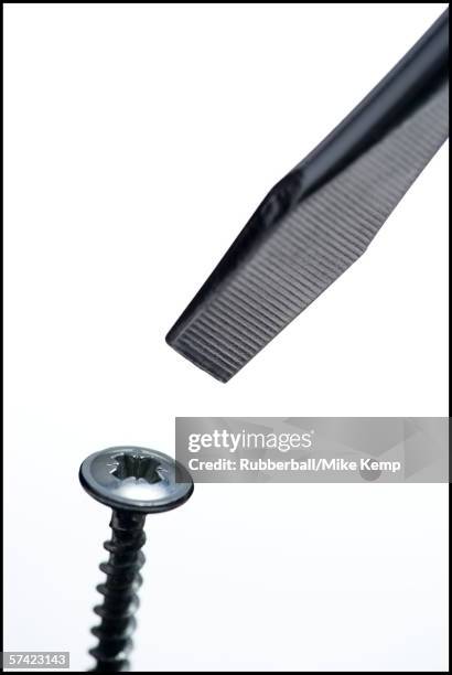 close-up of a screw and a screwdriver - mismatched pair stock pictures, royalty-free photos & images