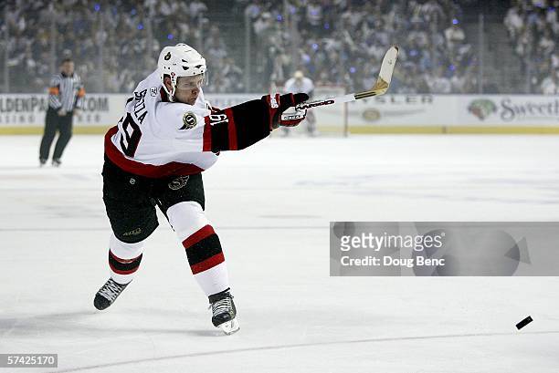 Jason Spezza of the Ottawa Senators takes a slap shot in the third period against the Tampa Bay Lightning in game three of the NHL Eastern Conference...