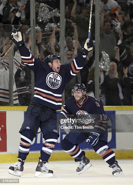 Jarret Stoll of the Edmonton Oilers celebrates his double overtime goal against the Detroit Red Wings as team-mate Sergei Samsonov skates in to...