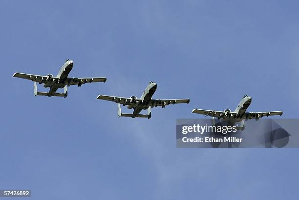 Three United States Air Force A-10 Thunderbolt II aircraft fly over Nellis Air Force Base while participating in the Joint Expeditionary Force...