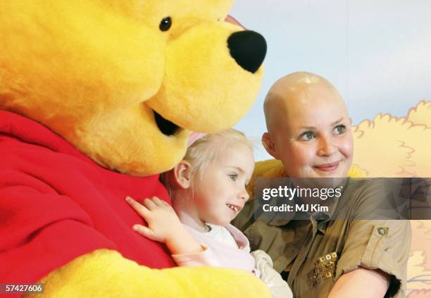 Presenter Gail Porter and her daughter Honey Porter hug Britain's beloved bear, Winnie the Pooh, to launch the UK's first National Cuddle Day and...