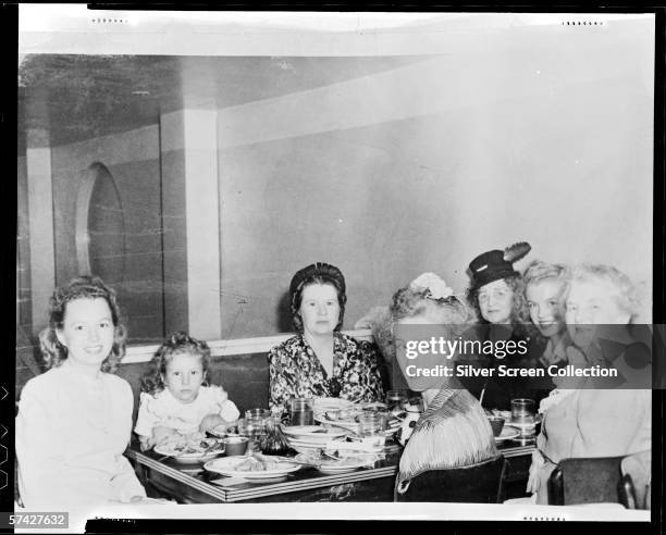 Norma Jeane Baker, future film star Marilyn Monroe , at a Chinese restaurant with members of her family, circa 1942.