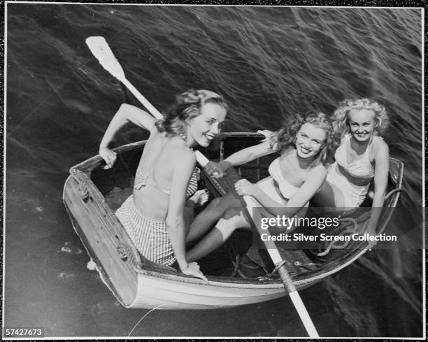 Norma Jeane Baker , future film star Marilyn Monroe , out rowing with a couple of friends, circa 1941.