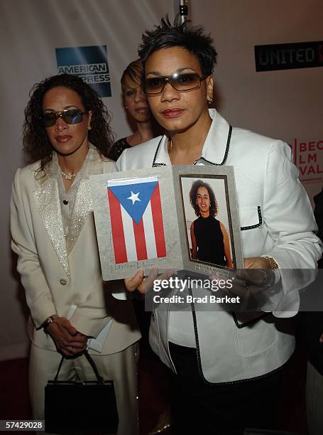 Lourdes LeBron holds a photo of her sister Waleska Martinez, a victim aboard Flight 93, at the premiere of "United 93" during the Fifth Annual...