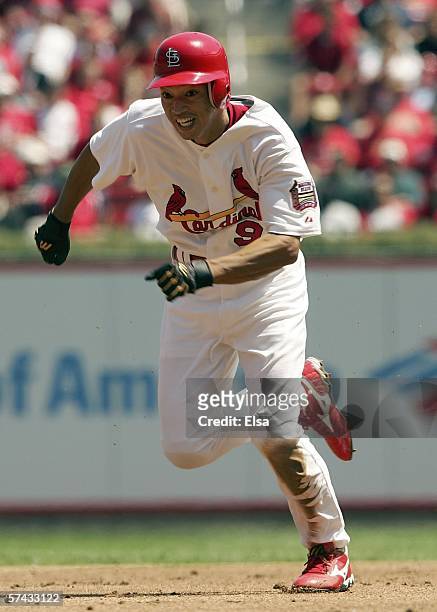 So Taguchi of the St. Louis Cardinals takes off from second base and scores a run against the Pittsburgh Pirates in the 2nd inning on April 26, 2006...