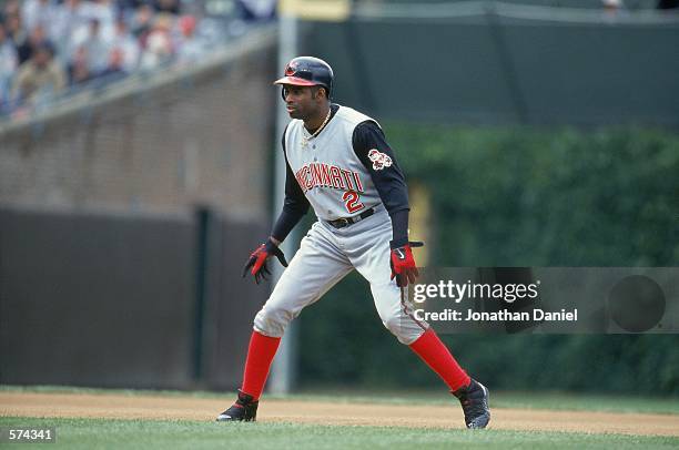 Deion Sanders of the Cincinnati Reds takes a lead off the base during the game against the Chicago Cubs at Wrigley Field in Chicago, Illinois. The...