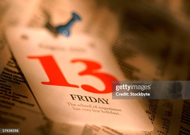 close-up of a friday the 13th tarot card tacked on a board - friday the 13th stock pictures, royalty-free photos & images