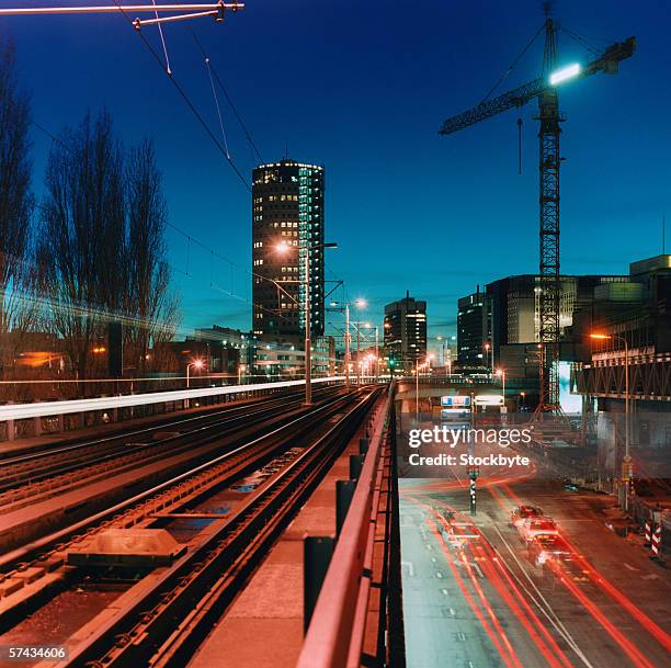 high angle time lapse view of traffic on a loading dock of a port - traffic time lapse stock pictures, royalty-free photos & images