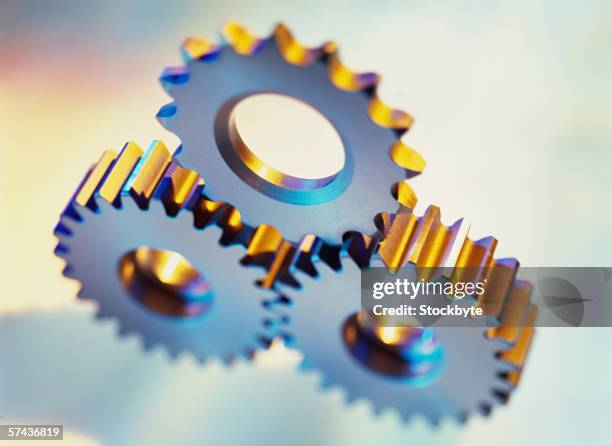 Triangular Cogs 533 Three Cogs Stock Photos, High-Res Pictures, and Images - Getty Images