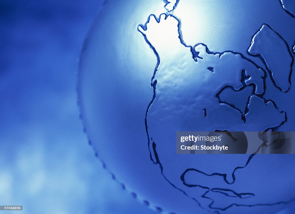 Tungsten close-up of a continent embossed on a metallic globe