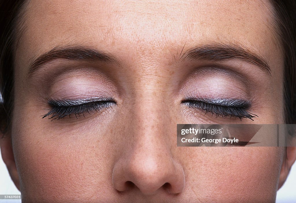 Close-up of a woman's eyes shut