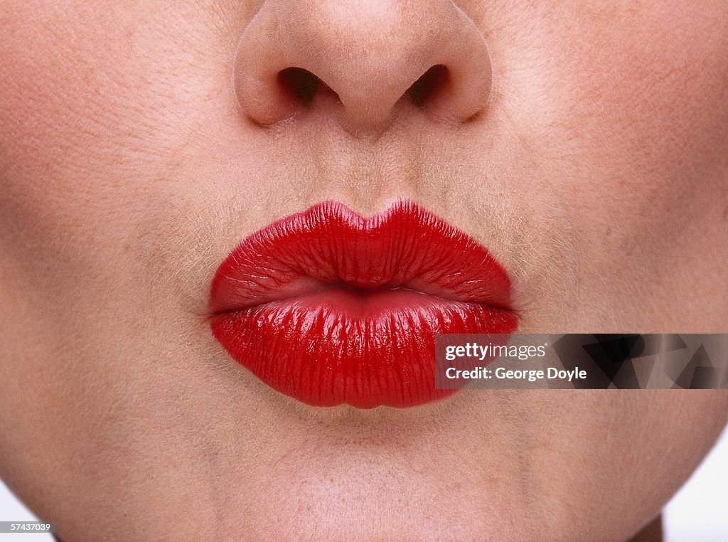 Close-up of a woman puckering her lips