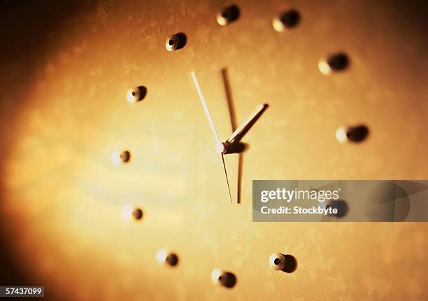 toned close-up of a surface fashioned into a clock - ominous clock stock pictures, royalty-free photos & images