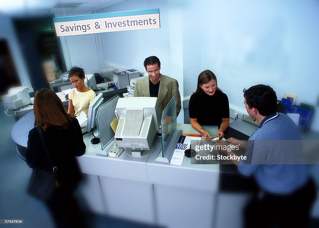 High angle view of customers and employees at a bank