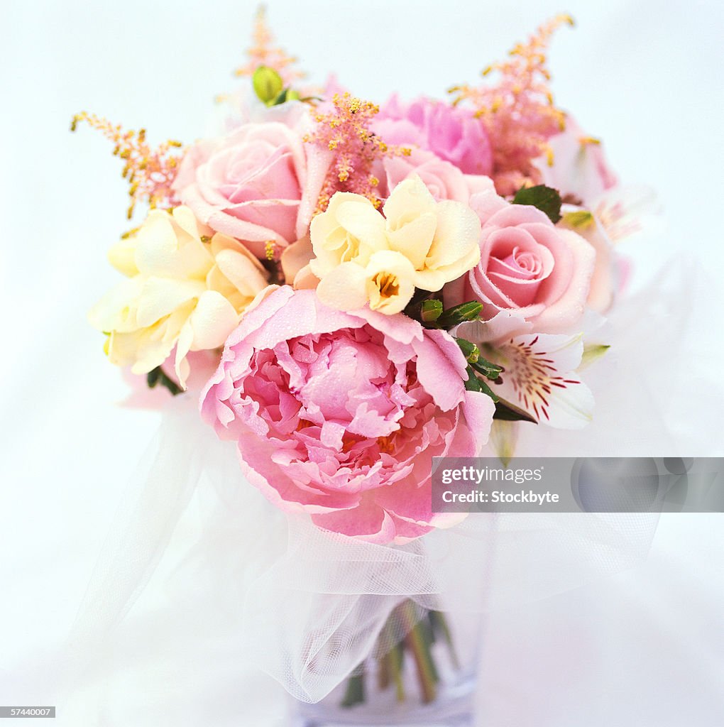 Close-up of a bouquet of pink and yellow roses