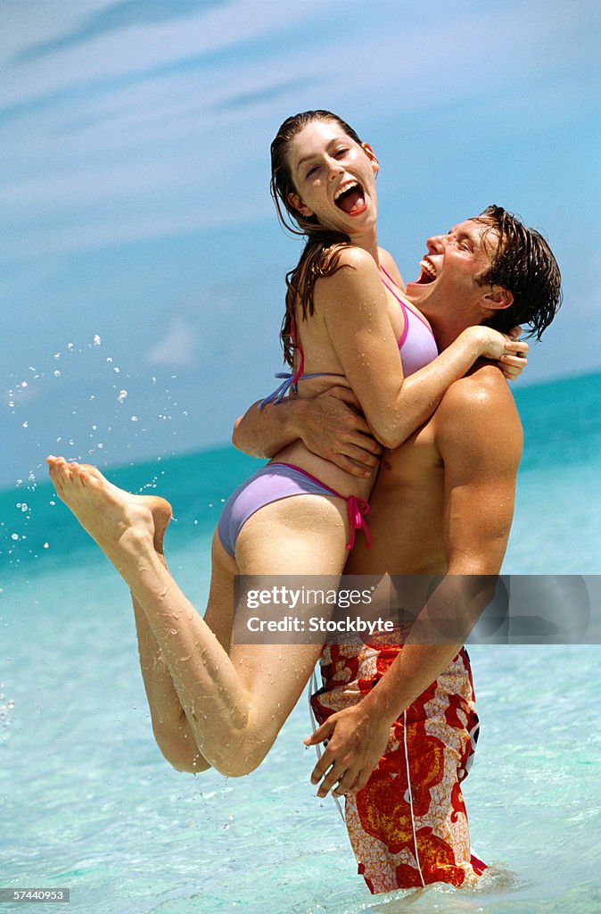 View of a young couple in the water