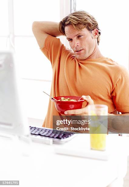 Eating A Computer Man Eating In Front Of Computer Photos and Premium High Res Pictures ...