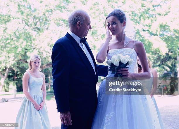 black and white portrait of a bride standing with her father - daughter crying stock pictures, royalty-free photos & images