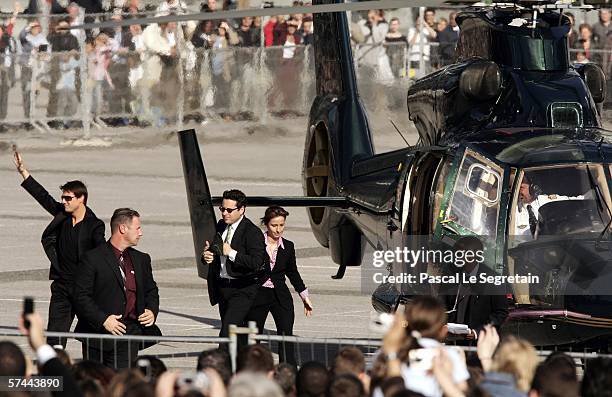 American Actor Tom Cruise waves as he arrives to attend the Mission: Impossible III French Premiere on April 26, 2006 in La Defense, outside Paris,...