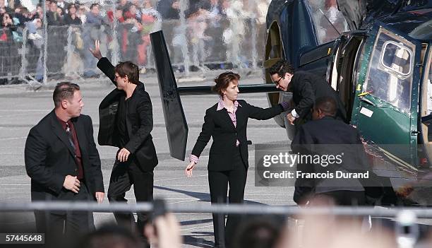 American actor Tom Cruise waves to the crowd after arriving at the "Mission: Impossible III" French Premiere on April 26, 2006 in La Defense, outside...