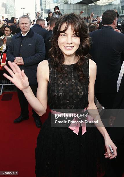 American actress Michelle Monaghan waves after arriving at the "Mission: Impossible III" French Premiere on April 26, 2006 in La Defense, outside...