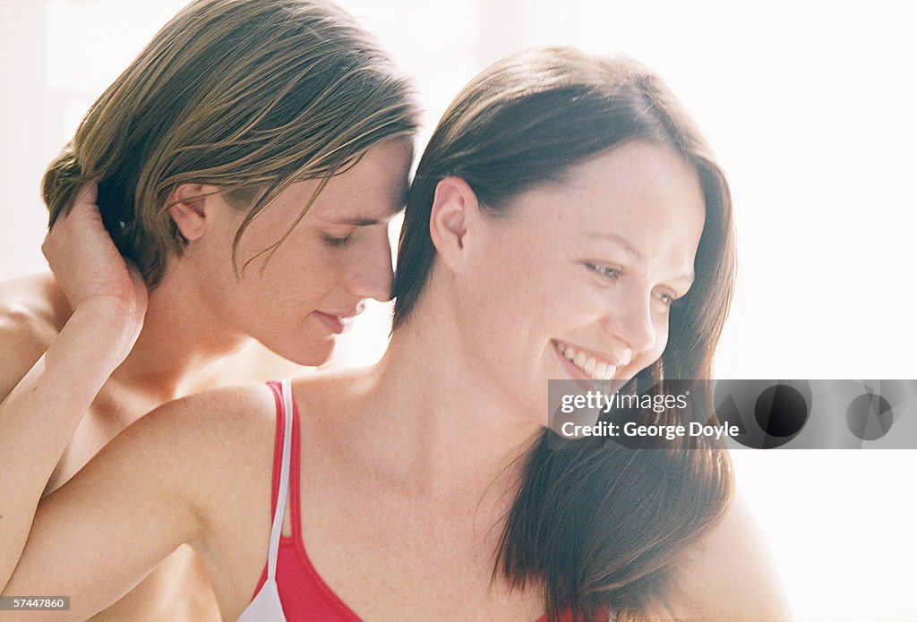 Close-up of a man kissing a woman's neck