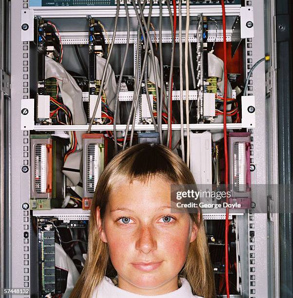 portrait of a woman standing in front of a mainframe computer - electrical fuse box stock pictures, royalty-free photos & images