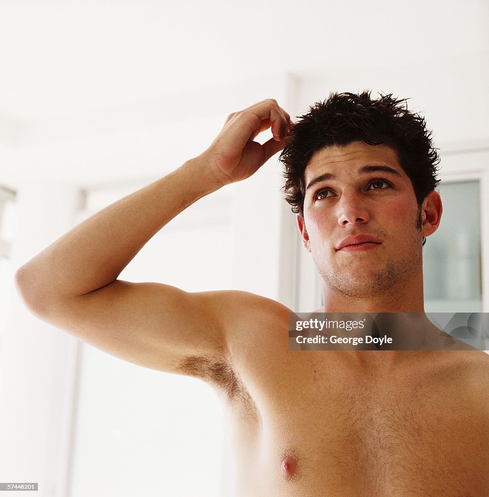 Close-up of a man checking his hair