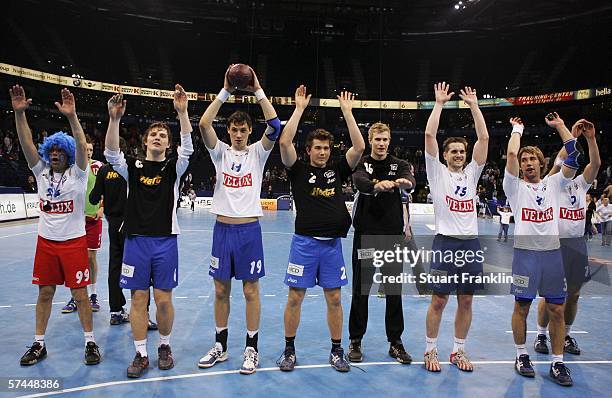 Hamburg players celebrate their win at the end of the Bundesliga match between HSV Handball and MT Melsungen at the Color Line Arena on April 26,...