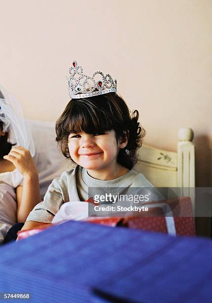 portrait of a boy (6-8) wearing a tiara and smiling - boy tiara stock pictures, royalty-free photos & images