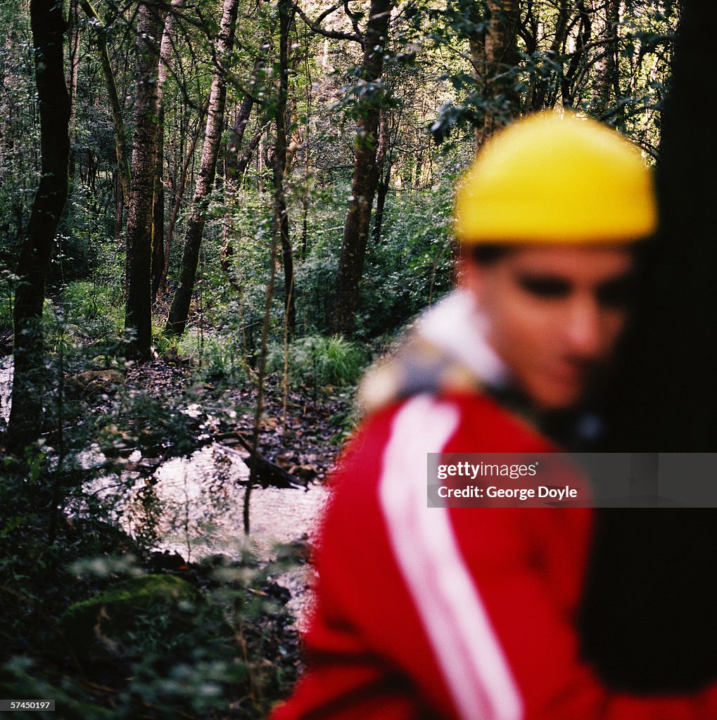 Close-up of young man in the forest