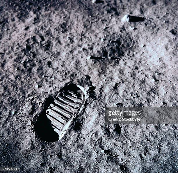 a man's footprints on the surface of the moon - fußabdruck stock-fotos und bilder