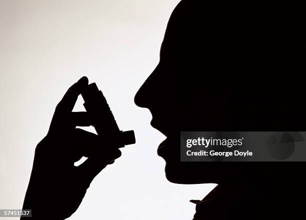 Person Using Inhaler Shadow 2,733 Person Taking Inhaler Stock Photos, High-Res Pictures, and Images ...